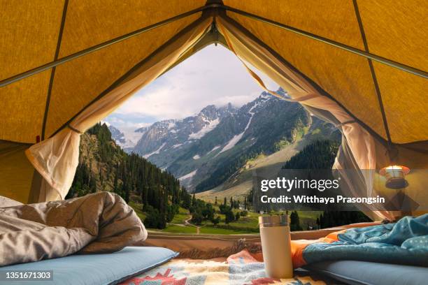 view from tent to the mountain - tent foto e immagini stock