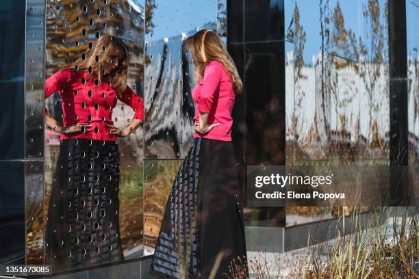 young confidence woman looking at the street mirror - negative photo illusion stock pictures, royalty-free photos & images