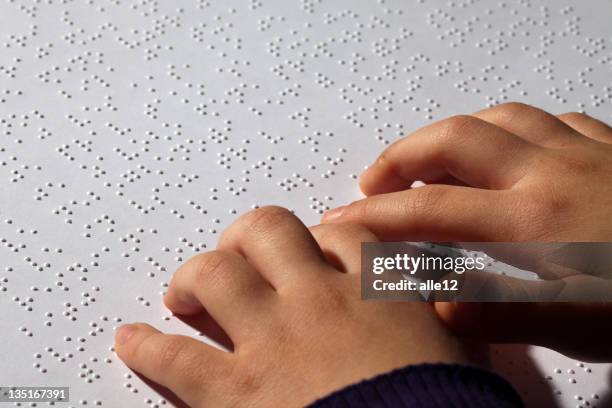 young girl eading braille - blindness stock pictures, royalty-free photos & images