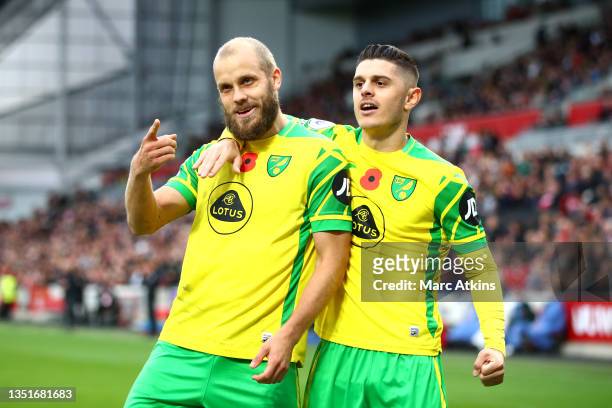 Teemu Pukki of Norwich City celebrates after scoring their sides second goal from a penalty with Milot Rashica during the Premier League match...