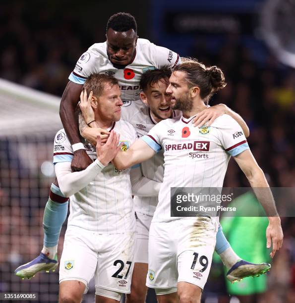 Matej Vydra celebrates with teammate Jay Rodriguez of Burnley after scoring their team's first goal during the Premier League match between Chelsea...
