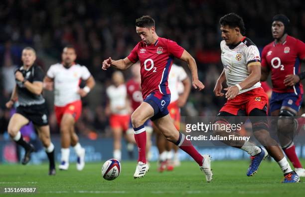 Alex Mitchell of England kicks through to go on to score a try which is later disallowed during the Autumn Nations Series match between England and...