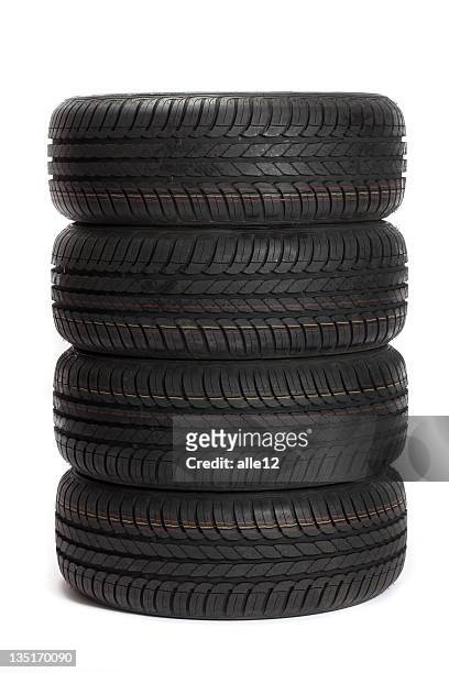 four black car tires stacked on top of one another - car wheel bildbanksfoton och bilder