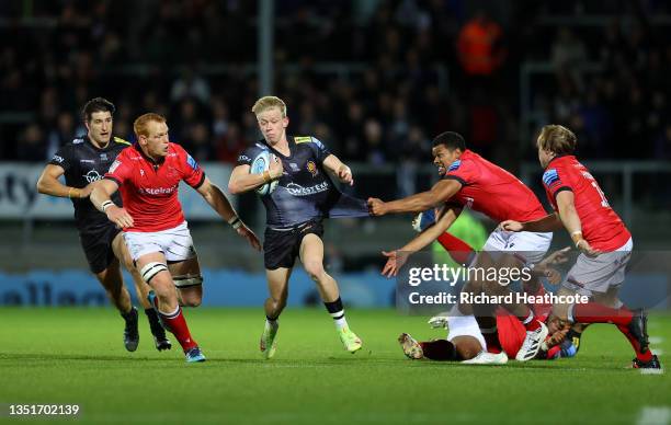 Josh Hodge of Exeter is tackled by Nathan Earle and Philip van der Walt of Newcastle during the Gallagher Premiership Rugby match between Exeter...