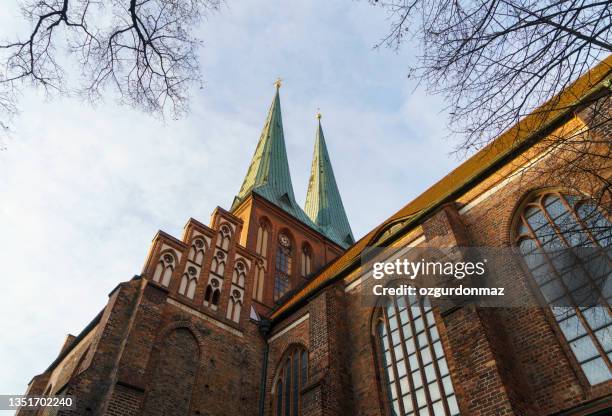 low angle view of church of st. nicholas in berlin. located in the historic quarter nikolaiviertel - catholicism stockfoto's en -beelden