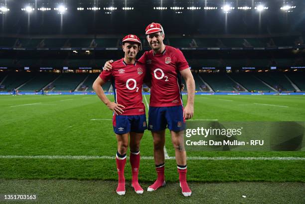 Mark Atkinson and Alex Mitchell of England pose for a photo with their first England cap following the Autumn Nations Series match between England...
