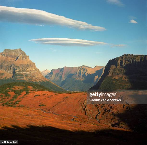 the view east from atop the continental divide in glacier national park - continental divide stock pictures, royalty-free photos & images