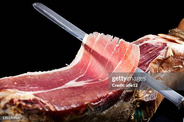 long knife cutting into a piece of prosciutto - ham salami bildbanksfoton och bilder