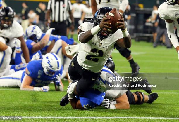 Tyhier Tyler of the Army Black Knights dives into the end zone for a touchdown in the third quarter against the Air Force Falcons at Globe Life Field...