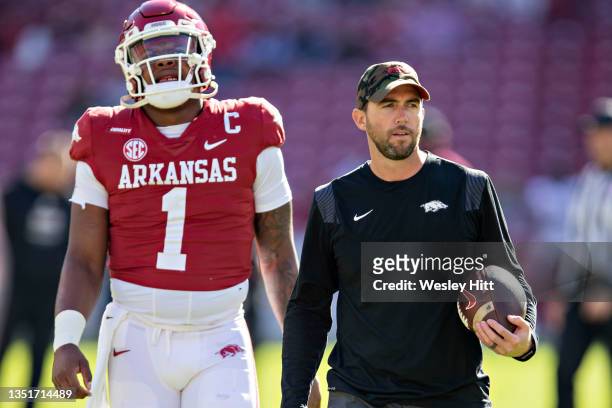 Offensive Coordinator Kendal Briles and KJ Jefferson of the Arkansas Razorbacks on the field before a game against the Mississippi State Bulldogs at...