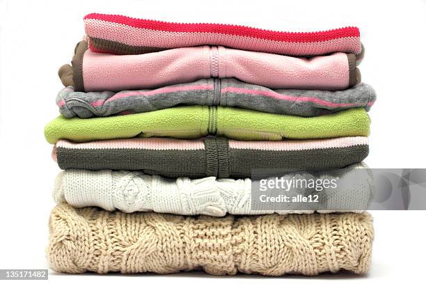 pile of colored sweaters isolated on white  - kledingstuk stockfoto's en -beelden