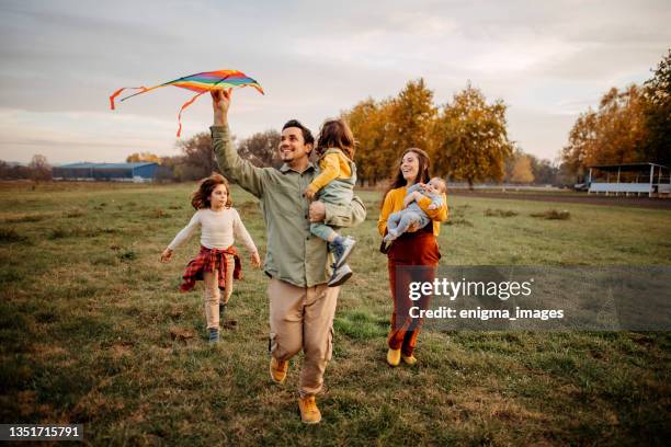 we will make you the happiest children in the world - kite flying stock pictures, royalty-free photos & images