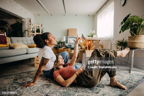 we start living together - friends talking living room stock pictures, royalty-free photos & images