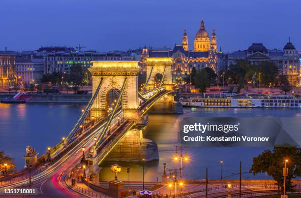 night view of budapest chain view and saint stephen's basilica - budapest skyline stock pictures, royalty-free photos & images