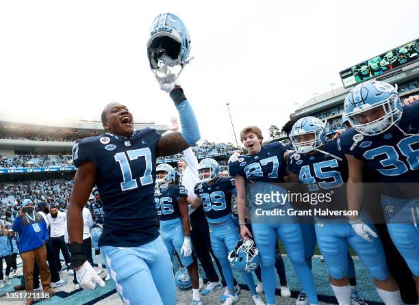 Chris Collins of the North Carolina Tar Heels leads the team in singing the alma mater after a win against the Wake Forest Demon Deacons at Kenan...