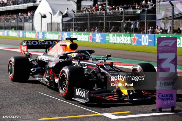 Third place qualifier Max Verstappen of Netherlands and Red Bull Racing climbs from his car in parc ferme during qualifying ahead of the F1 Grand...