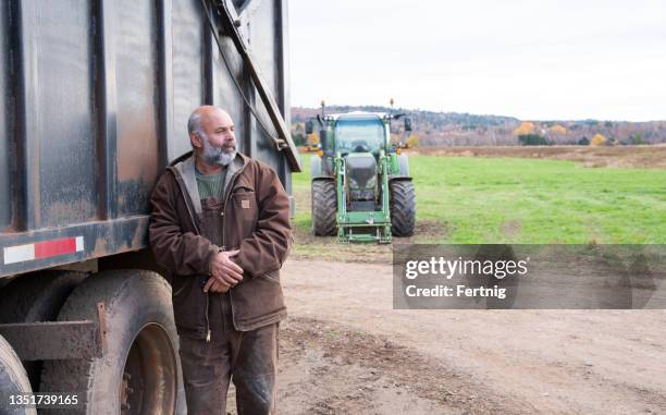 portrait of a male farmer at work - concerned farmers stock pictures, royalty-free photos & images