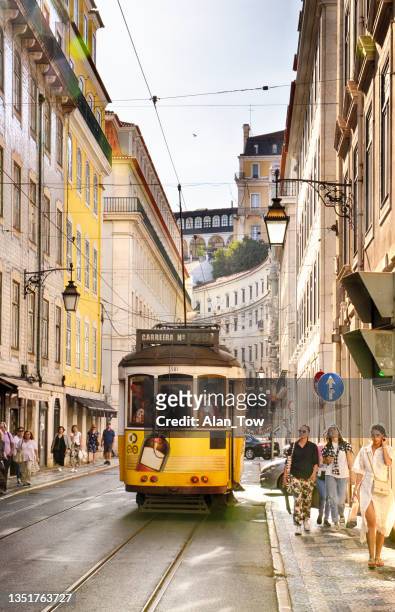 street scene and old tram in lisbon, portugal - tourism in lisbon stock pictures, royalty-free photos & images