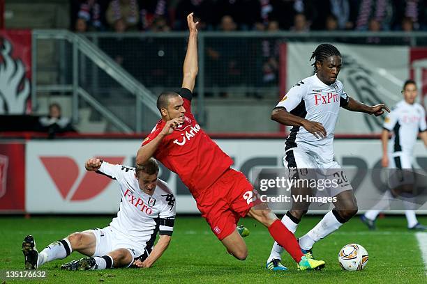 Brede Hangeland of Fulham,Nacer Chadli of FC Twente,Dickson Etuhu of Fulham during the Europa League match between FC Twente and Fulham FC at the...