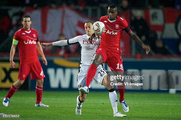 Bobby Zamora of Fulham,Douglas of FC Twente during the Europa League match between FC Twente and Fulham FC at the Grolsch Veste Stadium on December...