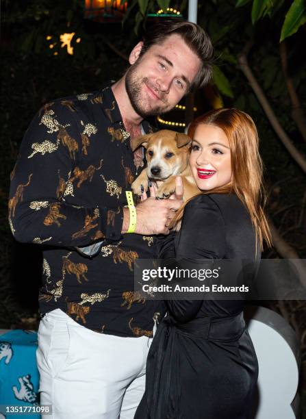 Actor Luke Benward and actress Ariel Winter meet "Cupid" the dog at the Wags & Walks 10th Annual Gala at the Taglyan Complex on November 06, 2021 in...