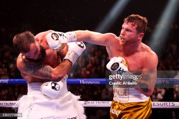 Canelo Alvarez punches Caleb Plant during their championship bout for Alvarez's WBC, WBO and WBA super middleweight titles and Plant's IBF super...