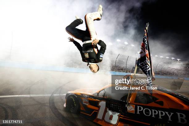 Daniel Hemric, driver of the Poppy Bank Toyota, celebrates with a backflip after winning the NASCAR Xfinity Series Championship at Phoenix Raceway on...