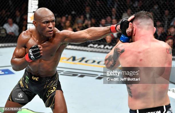 Kamaru Usman of Nigeria punches Colby Covington in their UFC welterweight championship fight during the UFC 268 event at Madison Square Garden on...