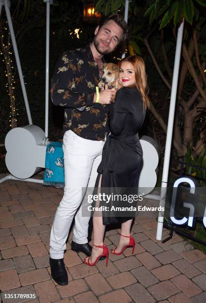 Actress Ariel Winter and actor Luke Benward meet "Cupid" the dog at the Wags & Walks 10th Annual Gala at the Taglyan Complex on November 06, 2021 in...