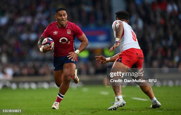 Manu Tuilagi of England takes on Sonatane Takulua of Tonga during the Autumn Nations Series match between England and Tonga at Twickenham Stadium on...