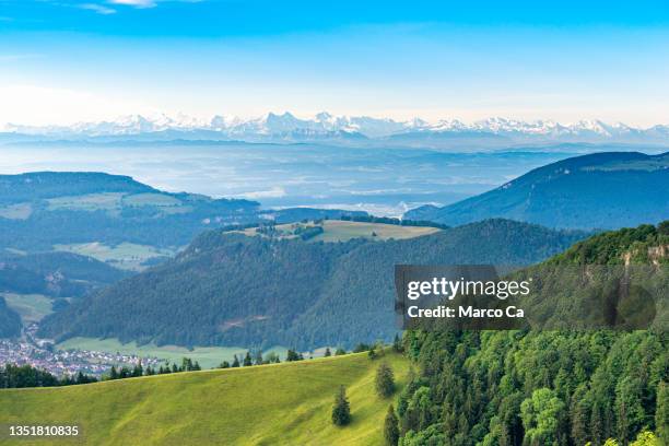 panoramic view over the jura mountains with the swiss alps on the horizon - solothurn stockfoto's en -beelden