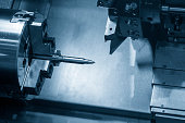 The  CNC lathe machine  cutting the sample bullet metal parts.