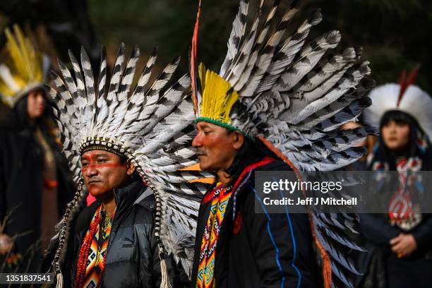 Indigenous people from the Amazon rainforest perform a sacred blessing ritual at Cormonachan woodlands on November 07, 2021 in Glasgow, Scotland. The...