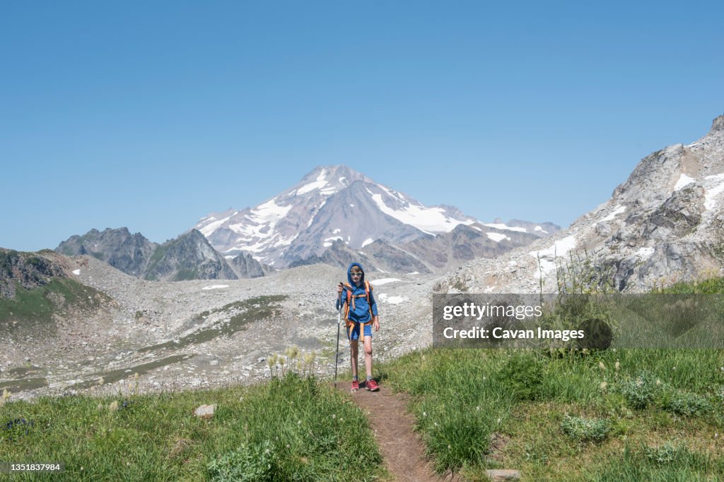 A boy backpacking in Glacier Peak Wilderness Area.