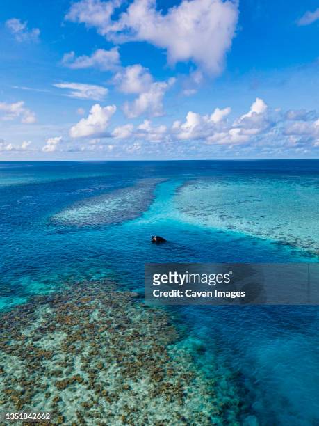 aerial view of shipwreck, maldives - maldives boat stock pictures, royalty-free photos & images