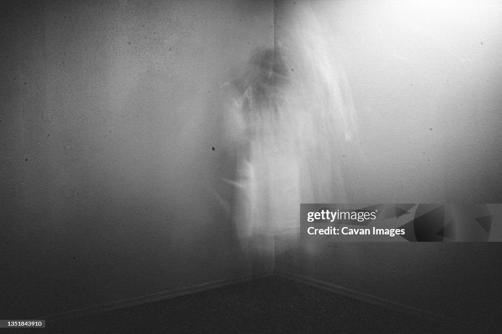 Ghostly figure watching from the corner of the room