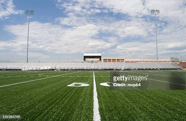 50 yard line in a football stadium - american football field stock pictures, royalty-free photos & images