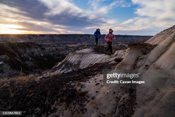 trail running in alberta's badlands - drumheller stock pictures, royalty-free photos & images