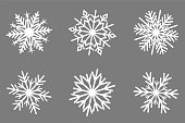 Set of nordic snowflakes on gray background.
