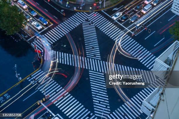 busy junction crossing in the evening,view from aerial - pedestrian crash stock pictures, royalty-free photos & images