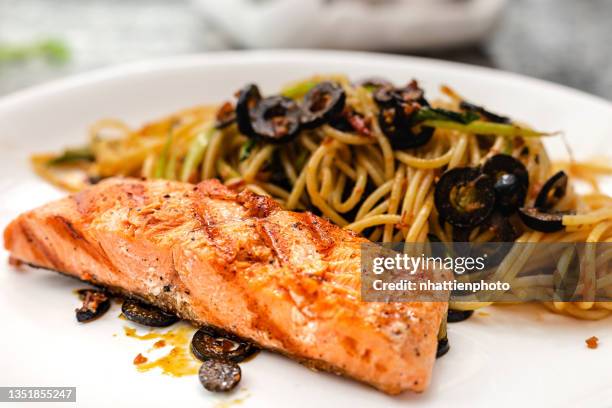 salmon seared spaghetti pasta on white plate high resolution - pasta salad stock pictures, royalty-free photos & images