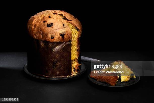 studio shot of freshly baked panettone sweet bread - panettone stock pictures, royalty-free photos & images