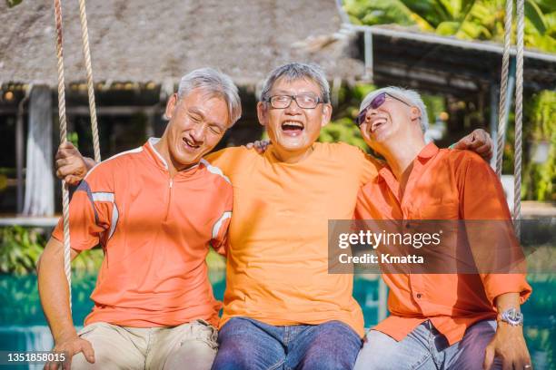 laughing grandfather during hanging out. - liberty mutual insurance stock pictures, royalty-free photos & images