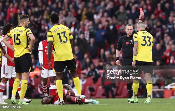 Juraj Kucka of Watford FC is shown a red card by Match Referee, Kevin Friend after a challenge on Nuno Tavares of Arsenal during the Premier League...