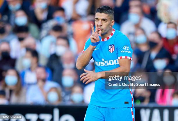 Luis Suarez of Club Atletico de Madrid celebrates after scoring his team's first goal during the LaLiga Santander match between Valencia CF and Club...