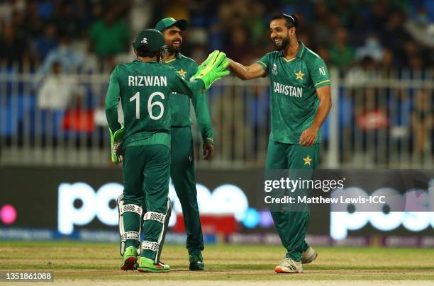 Imad Wasim of Pakistan celebrates after running out Matthew Cross of Scotland with team mate Mohammad Rizwan during the ICC Men's T20 World Cup match...