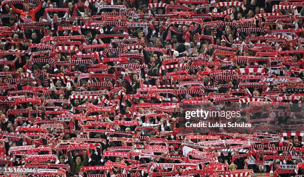 Koln fans raise scarves as they show their support prior to the Bundesliga match between 1. FC Köln and 1. FC Union Berlin at RheinEnergieStadion on...