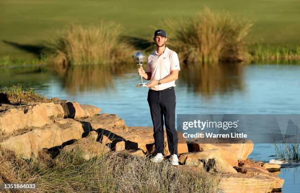 Thomas Pieters of Belgium celebrates with the winners trophy after the final round of the Portugal Masters at Dom Pedro Victoria Golf Course on...