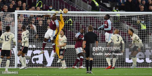 Alisson Becker of Liverpool scores an owen goal during the Premier League match between West Ham United and Liverpool at London Stadium on November...