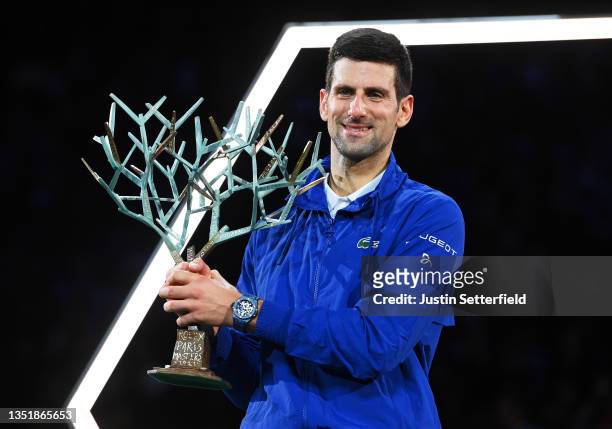 Novak Djokovic of Serbia celebrates with the trophy after winning the Men's Single's final match between Novak Djokovic of Serbia and Daniil Medvedev...